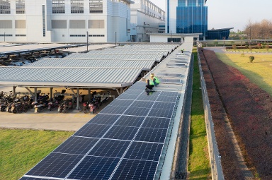 two auditors inspect a solar installation for 14001 certification