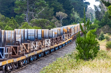 steel being hauled on a train
